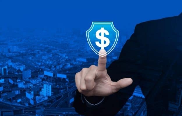 a business man is pointing at the money logo inside the shield ca